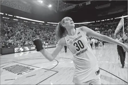  ?? ELAINE THOMPSON/AP FILE PHOTO ?? Breanna Stewart of the Seattle Storm tosses a T-shirt to fans after the Storm’s 85-77 win over the New York Liberty in a game Aug. 17 in Seattle. Stewart was named Tuesday as Associated Press WNBA Player of the Year.