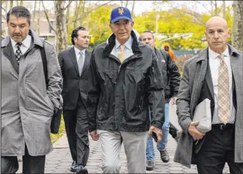  ?? Yuki Iwamura The Associated Press ?? Tom Barrack, center, former chairman of President Donald Trump’s inaugural committee, arrives Monday at federal court in New York.