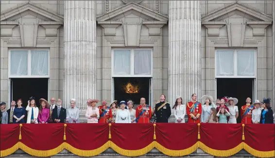  ?? (File Photo/AP/Lefteris Pitarakis) ?? Britain’s Queen Elizabeth II, surrounded by members of the family, stands June 14, 2014, on the balcony of Buckingham Palace after the Trooping The Color parade in central London.