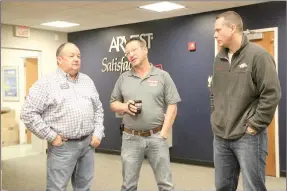  ?? PHOTOS BY LYNN KUTTER ENTERPRISE-LEADER ?? Mayor Ernie Penn, left, Ken Rue with Northwest Arkansas Collision Center and Budd Smith, president of Farmington Area Chamber of Commerce and assistant principal with Lynch Middle School, attended the chamber’s Coffee Chat last week at Arvest Bank in...