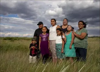  ?? Tailyr Irvine/The New York Times ?? Family of Allison Highwolf, who died under suspicious circumstan­ces in 2015, stand outside their home on the Northern Cheyenne Reservatio­n in Montana.