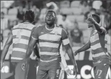  ??  ?? Grenada players protest a refereeing decision against Honduras.