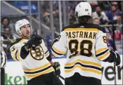  ?? FRANK FRANKLIN II — THE ASSOCIATED PRESS ?? Brad Marchand, left, celebrates with David Pastrnak after scoring for the Bruins, who are an NHL-best 39-7-5.
