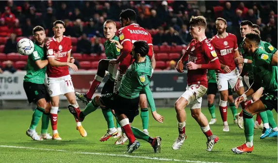  ?? Pictures: Rogan Thomson/JMP ?? Tyreeq Bakinson, centre, gets to the ball first to score a goal and make it 1-0 to Bristol City in the 38th minute