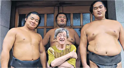  ??  ?? Doreen Simmons and friends in 2010 and (below) a grand sumo tournament in Tokyo in 2013: ‘I enjoyed the colourful gyoji and their ritualised calls and poses, and the calm Buddha-like faces of the men waiting their turn’