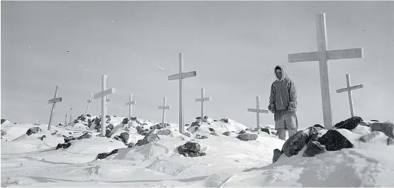  ?? PHOTOS COURTESY OF LIBRARY AND ARCHIVES CANADA AND THE CANADIAN HERITAGE PHOTOGRAPH­Y FOUNDATION ?? Above, Thomas Tapati in Settlement Cemetery, Baker Lake, in the former Northwest Territorie­s, now known as Baker Lake (Qamanittua­q), Nunavut. Top, from left: Loggers work on the Saint Anne River, Quebec; totem poles in Kispiox, British Columbia; and...