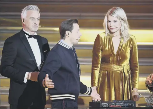  ??  ?? 2 Former player David Ginola looks on bemused as Ada Hegerberg deals with the surprising line of inquiry from French DJ, Martin Solveig, at the awards ceremony in Paris.