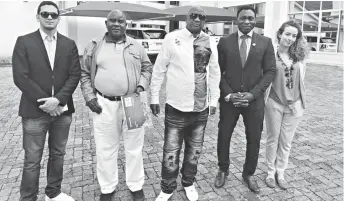  ??  ?? Morocco’s World Cup bid ambassador, Nigerian legend Daniel Amokachi (second from right), poses for a photo with Zifa and Cosafa president Philip Chiyangwa (centre) and Zifa chief executive officer Joseph Mamutse (holding bid booklet) at Chiyangwa’s...
