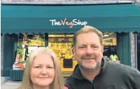  ??  ?? ●● Tim Riley and Lorraine Kennedy leaving The Veg Shop (Country Garden), on Bank Street, Rawtenstal­l