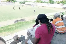  ?? RICARDO MAKYN MULTIMEDIA PHOTO EDITOR ?? Supporters of Arnett Gardens Football Club watching a training session at the Anthony Spaulding Sports Complex yesterday.