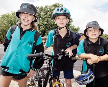  ??  ?? Charlie Breden and Lara Williams (Grade 6) and Isaac Saward (Grade 3) are all active travellers to school and enjoy the exercise over being driven.