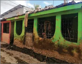  ?? (AP/Ana Morazan) ?? Mud from hurricanes Eta and Iota cover Morazan’s home in November 2020 near San Pedro Sula, Honduras.