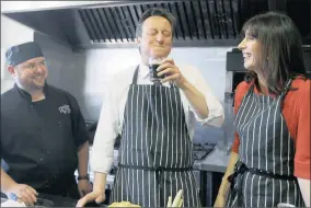  ?? PHOTO: REUTERS ?? Britain’s Prime Minister David Cameron tastes some stout with his wife Samantha during a visit to Brains Brewery in Cardiff, Wales. Cameron has promised a referendum on EU membership if he wins the May 7 election.