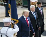  ?? ALEX BRANDON — THE ASSOCIATED PRESS ?? President Donald Trump, Vice President Mike Pence, and Defense Secretary Mark Esper arrive to place a wreath at the Tomb of the Unknown Soldier in Arlington National Cemetery, in honor of Memorial Day in Arlington, Va.