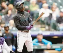  ?? DAVID ZALUBOWSKI/AP ?? Marlins’ Jazz Chisholm Jr. follows the flight of his three-run home run off Rockies starting pitcher Antonio Senzatela in the fourth inning of the first game of a doublehead­er Wednesday in Denver.