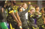  ?? CHANCEY BUSH/JOURNAL ?? United players celebrate their victory during the U.S. Open Cup match against Real Salt Lake at Isotopes Park on Wednesday.