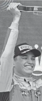  ?? LUCA BRUNO/AP ?? Mclaren driver Lando Norris celebrates on the podium at the Emilia Romagna Formula One Grand Prix in Imola, Italy, on April 24. Mclaren is determined to become the official team of North America and is chasing fans and sponsors throughout the United States, Mexico and Canada.