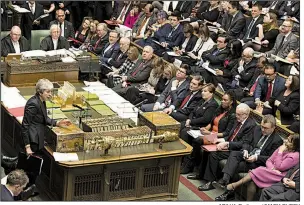  ?? AP/U.K. Parliament/MARK DUFFY ?? British Prime Minister Theresa May (lower left) speaks during question time Wednesday in the House of Commons as she again seeks Parliament approval for her twice-rejected European Union exit plan.