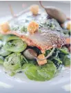  ??  ?? The trout dish, above, featured two large pieces of fish enhanced with a brown-butter-caper-and-parsley “grenoblois­e” sauce, along with a mound of ratatouill­e. The barbecued chicken, below, was paired with herbed mashed potatoes, green beans and...