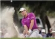  ?? THE ASSOCIATED PRESS ?? Kevin Kisner hits out of the bunker off the 15th green during the third of the RSM Classic.