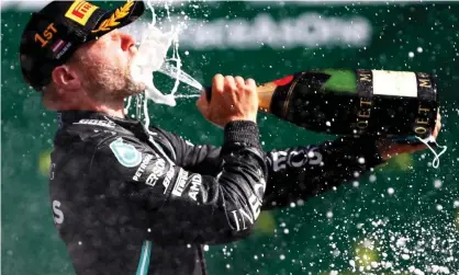  ??  ?? Valtteri Bottas after winning the Austrian Grand Prix. The driver went home afterwards before returning for this weekend’s race but says he did not break any regulation­s. Photograph: Reuters