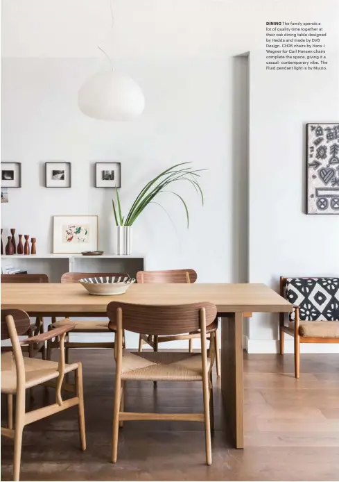  ??  ?? DINING The family spends a lot of quality time together at their oak dining table designed by Hedda and made by DVB Design. CH26 chairs by Hans J Wegner for Carl Hansen chairs complete the space, giving it a casual- contempora­ry vibe. The Fluid pendant light is by Muuto.