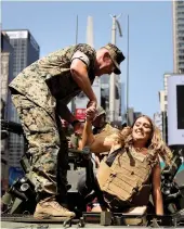  ?? — AFP ?? A woman tours a United States Marine military vehicle in Times Square as part of Fleet Week festivitie­s in New York on Thursday.