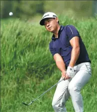  ?? STAN BADZ / US PGA TOUR ?? Zhang Xinjun chips during the opening round of last April’s Web.com Tour United Leasing & Finance Championsh­ip at Victoria National Golf Club in Newburgh, Indiana.