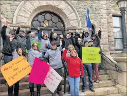  ?? JUANITA MERCER/THE TELEGRAM ?? Some of the people who attended the demonstrat­ion outside the Supreme Court in St. John’s Saturday morning gathered for a photo.