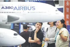  ??  ?? Visitors look at models of an Airbus A380 and an Airbus A350 plane at the Beijing Internatio­nal Aviation Expo in Beijing on September 19. European companies suffer from ‘promise fatigue’ over China’s failure to follow through on pledges to open its...