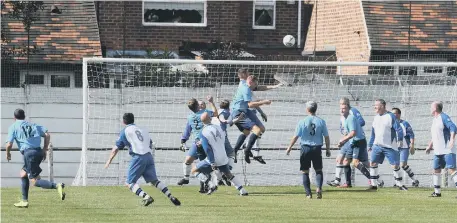  ??  ?? Action from The Times Inn O40s (white/blue) v Ferryhill Greyhound O40s (light blue) at the Billy Hardy Centre on Saturday.