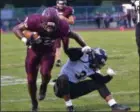  ?? THOMAS NASH - DIGITAL FIRST MEDIA ?? Pottsgrove fullback Jadore Colbert (32) plows by Glen Mills’ linebacker Robert Hill (3) on a 23-yard reception during the first half of Friday’s game.