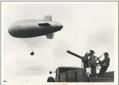  ?? / INP (Internatio­nal News Photos) ?? An observatio­n balloon from Fort Bragg, N.C., is sent aloft to observe “enemy” movements during the extensive war games at Fort Benning in Georgia in this undated photo. Fort Benning is one of the military bases Congress wants to rename, but President Donald Trump disapprove­s.