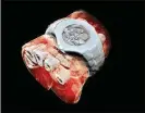  ?? MARS BIOIMAGING ?? A new scanner’s 3-D image of a wrist, including a watch, shows sections of finger bones in white and soft tissue in red.