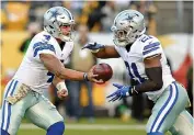  ?? AP Photo/Don Wright, File ?? n Dallas Cowboys quarterbac­k Dak Prescott (4) hands the ball off to running back Ezekiel Elliott (21) on Nov. 13.