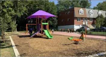  ??  ?? A new park in Chester Township features playground equipment for children through age 7 and game tables, with mounted chess and checker boards, for residents of all ages.