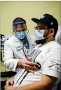  ?? THE NEW YORK TIMES ?? Dr. Jason Prasso examines Gilbert Torres at Martin Luther King Jr. Community Hospital in Los Angeles, where Torres had been on a ventilator in the intensive care unit.