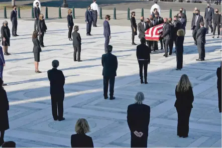 ?? ALEX BRANDON/ASSOCIATED PRESS ?? The flag-draped casket of Justice Ruth Bader Ginsburg arrives Wednesday at the Supreme Court in Washington. Ginsburg died Friday of cancer. Ginsburg, a champion of women’s rights and a liberal icon, was 87.