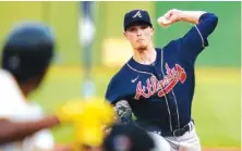  ??  ?? Atlanta Braves starter Max Fried pitches in the first inning on Monday.
