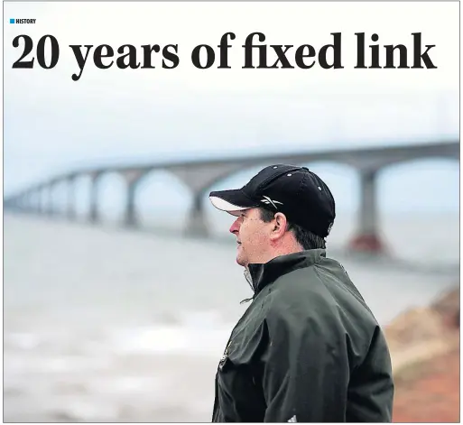  ?? NATHAN ROCHFORD/CP ?? Robert MacMillan looks out over the water during a visit to the Confederat­ion Bridge earlier this month. MacMillan worked as a first mate on the M.V. Holiday Island and then worked transporti­ng crews out to the piers during the constructi­on of the...