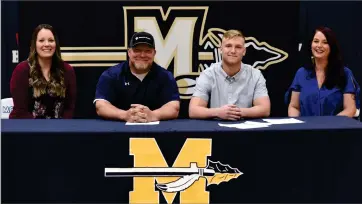  ?? RECORDER PHOTO BY NAYIRAH DOSU ?? Monache High School’s Hunter Weimer, second from right, signed a letter of intent to wrestle for Concorida University, Thursday, Feb. 25, 2021 at Monache High School.