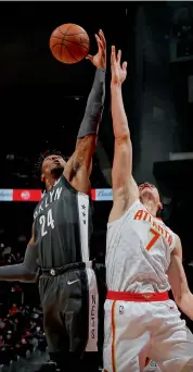  ?? AFP ?? Brooklyn Nets’ Rondae Hollis- Jefferson ( left) in action against Ersan Ilyasova of the Atlanta Hawks at Philips Arena on Friday in Atlanta, Georgia. Nets won 110- 105.
—