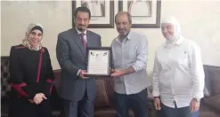  ??  ?? AMMAN: Kuwait’s Ambassador to Jordan Dr Hamad Al-Duaij delivers donations to Jordanian charity societies.