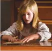  ?? | UNIVERSAL PICTURES ?? Young Doris ( Lulu Wilson) attempts to communicat­e with her late father in “Ouija: Origin of Evil.”