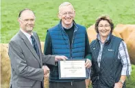  ?? Picture: Craig Stephen. ?? Dr Robert Graham, centre, receives the award from Keith Brooke, with RHASS director Anne Logan alongside.