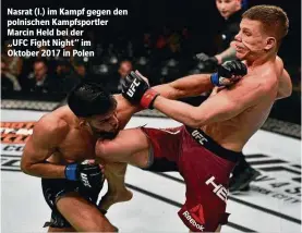  ??  ?? Nasrat (l.) im Kampf gegen den polnischen Kampfsport­ler Marcin Held bei der
„UFC Fight Night“im Oktober 2017 in Polen