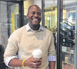  ?? AP PHOTO ?? Darlington Ibekwe, a lawyer who lives in Los Angeles, poses for a photo in front of a coffee shop in Los Angeles on Thursday.