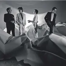  ??  ?? Top right: Work with suited businessme­n prepared him for work like this shot of Ultravox for their album, Vienna