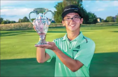  ?? PROVIDED TO CHINA DAILY ?? Dou Zecheng holds the winner’s trophy after his historic victory at the Digital Ally Open in Kansas on Sunday. The 20-year-old became the first Chinese mainland player to win on the Web.com Tour and the first to earn a PGA Tour card.