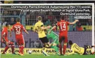  ?? – REUTERSPIX ?? Dortmund’s Pierre-Emerick Aubameyang (No. 11) scores a goal against Bayern Munich at Signal Iduna Park, Dortmund yesterday.